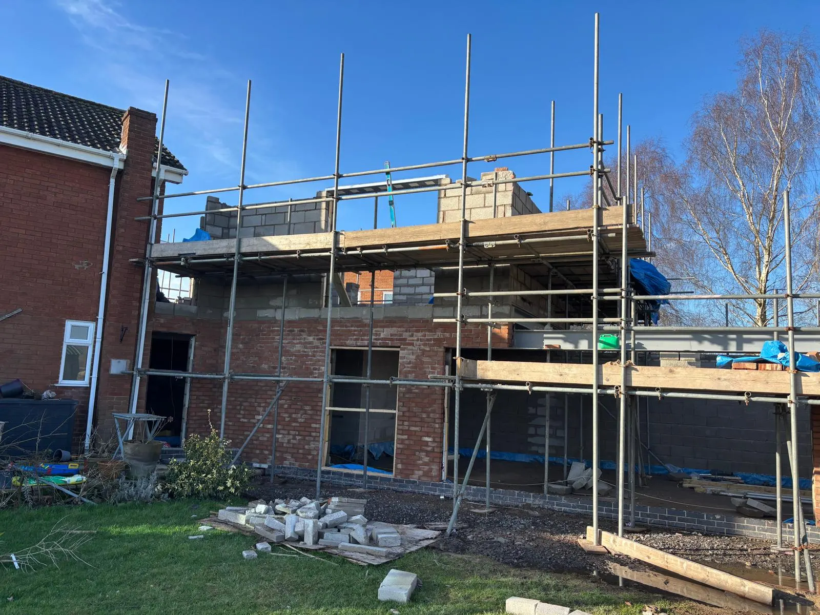 House extension with exposed blockwork and scaffolding